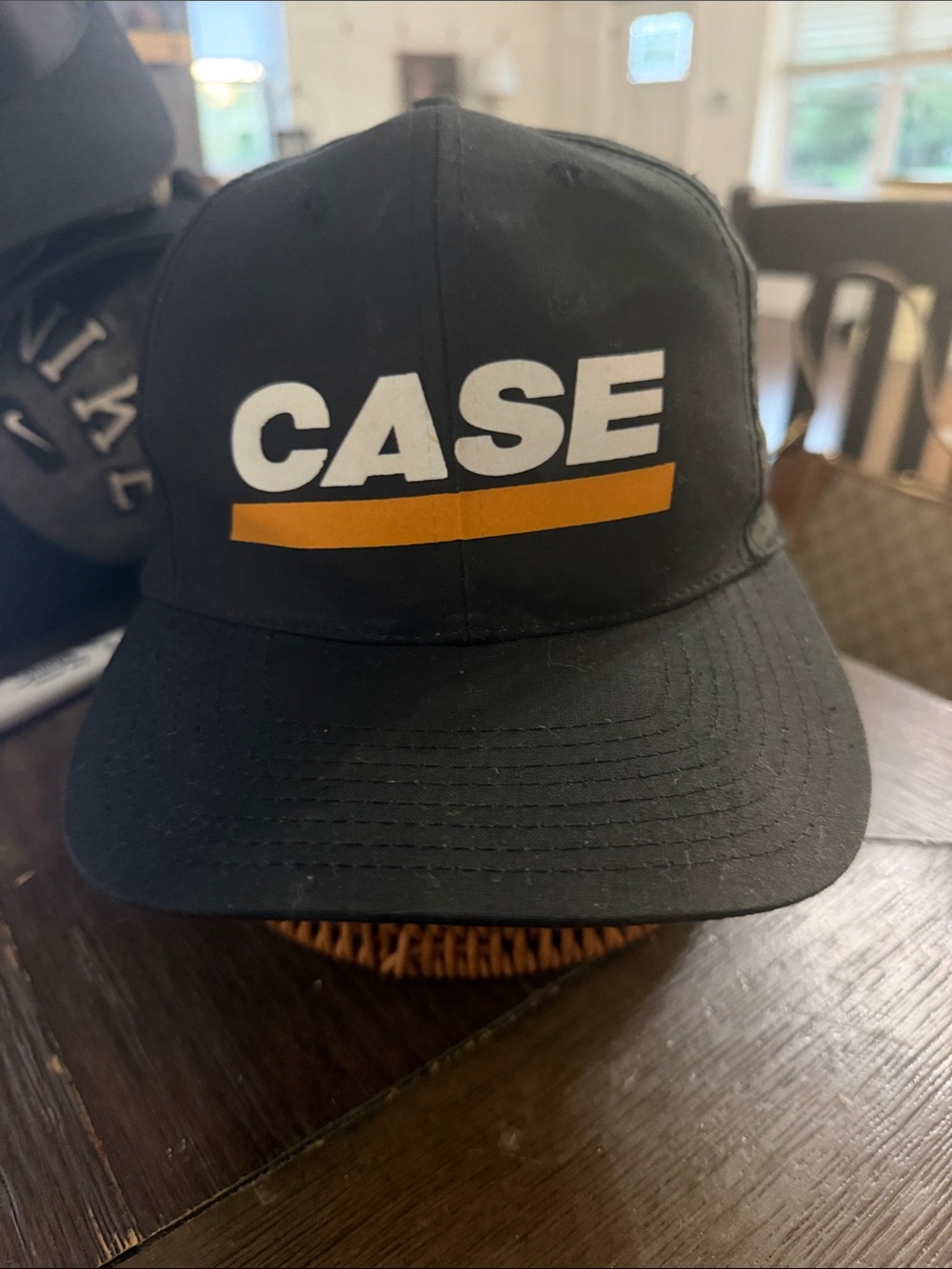 Source Unknown Black Hat with White CASE Logo and Gold Stripe